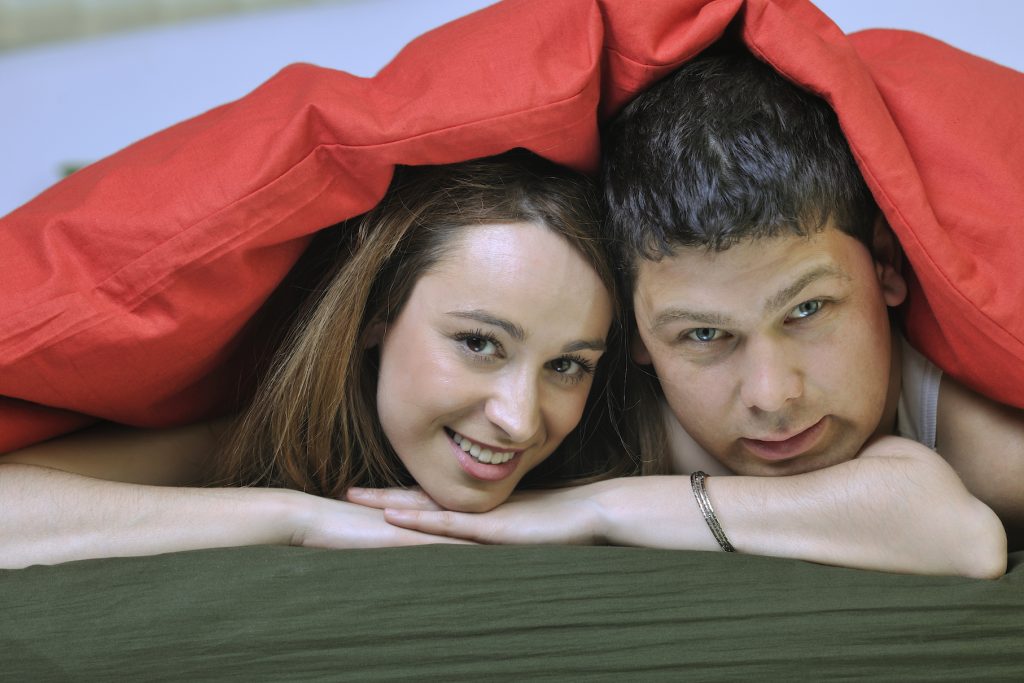 young couple in bed