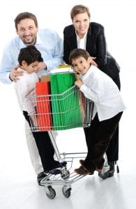 Happy family with a shopping cart