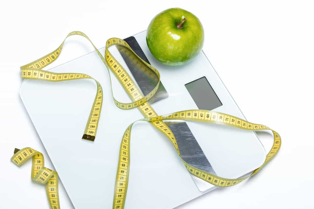 Apple, Scale, and Tape Measure