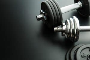 The metal dumbbell and weights.