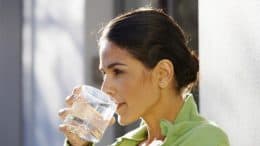 A Woman drinking water.